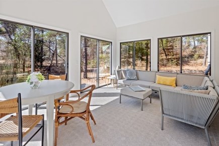 Wellfleet Cape Cod vacation rental - lots of seating in the sunroom, great for morning coffee or cockt