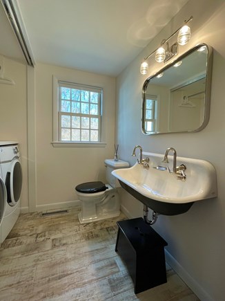 Sandwich, In Village across Shawme Pond Cape Cod vacation rental - First floor laundry with oversized sink.