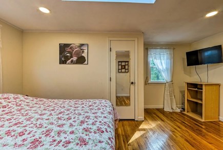 Mashpee Cape Cod vacation rental - Large bedroom with queen bed and flat-screen tv