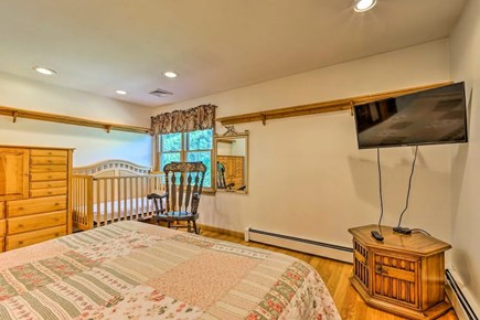 Mashpee Cape Cod vacation rental - Bedroom with queen bed and crib