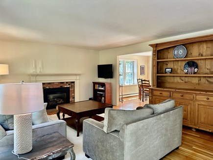 Brewster Cape Cod vacation rental - Living room that opens to dining room, kitchen and deck.