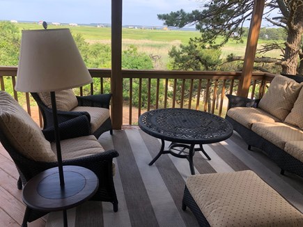North Eastham Cape Cod vacation rental - Outdoor seating area on covered deck