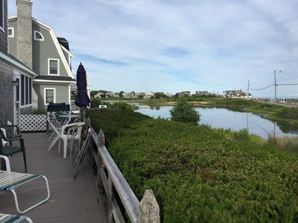 Falmouth Heights Cape Cod vacation rental - 40 foot deck with table and chairs, umbrellas, lounge chairs
