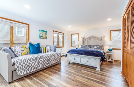Falmouth Cape Cod vacation rental - First floor bedroom with queen and 2 twins with access to deck