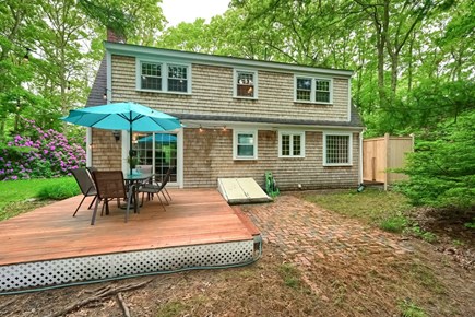 East Sandwich Cape Cod vacation rental - Backyard with dining area and outdoor shower.