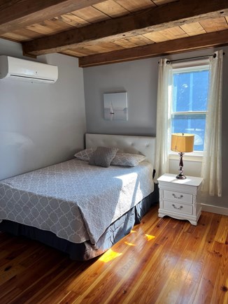 Harwich Cape Cod vacation rental - Downstairs bedroom featuring a queen bed.
