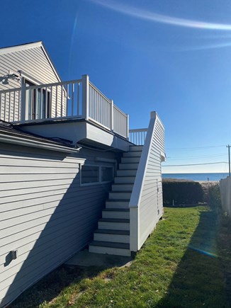 Hyannis Cape Cod vacation rental - Stairway entrance to upstairs unit and deck.