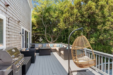 Chatham House Cape Cod vacation rental - Massive deck with porch swing, BBQ grill, and ample seating