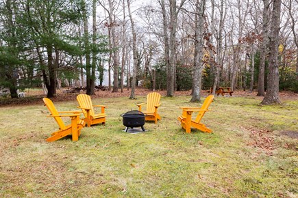Cotuit Cape Cod vacation rental - Our ample backyard with seating, fire pit, and picnic table.