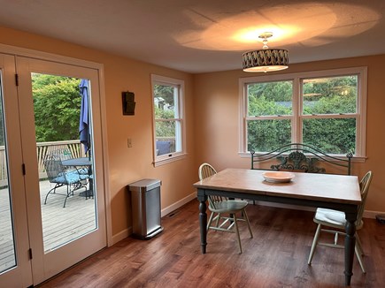 Harwich Port Cape Cod vacation rental - Kitchen/dining area with view of deck.
