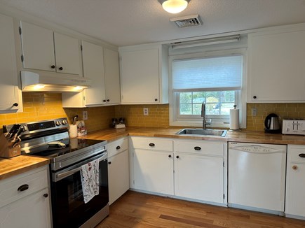Yarmouth, Honeybee Cottage Cape Cod vacation rental - Kitchen with all the amenities you'll need for a family meal.