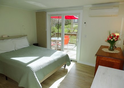 Eastham Cape Cod vacation rental - Main bedroom with queen and new slider to back deck 