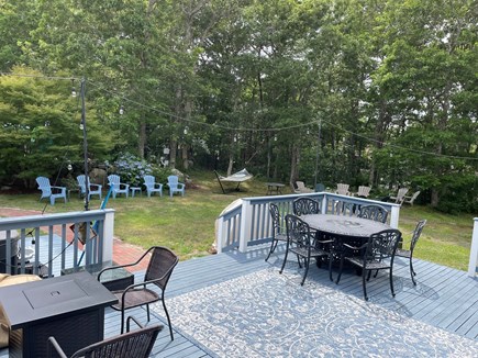 Yarmouth Port Cape Cod vacation rental - Two fire tables on back deck. Yard has hot tub, fire pit.