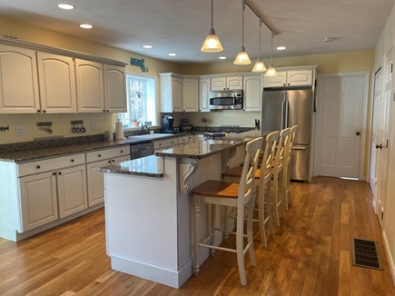 Yarmouth Port Cape Cod vacation rental - Kitchen opens to dining room. Seats 4 at island. Granite counters