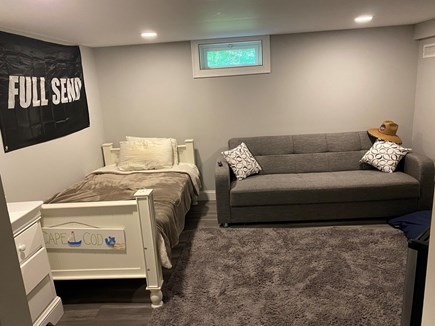 West Hyannisport Cape Cod vacation rental - Basement Bedroom With Couch and Large TV