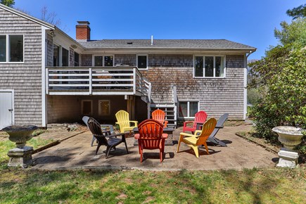 Centerville Cape Cod vacation rental - Porch w/grill and dining table; patio w/firepit and chairs