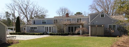 Osterville Cape Cod vacation rental - Back yard with larger outdoor shower, pool, grill area, and yard
