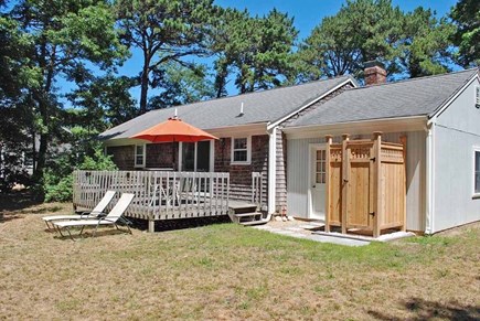 Brewster Cape Cod vacation rental - large back yard with deck, outdoor shower, and lawn space