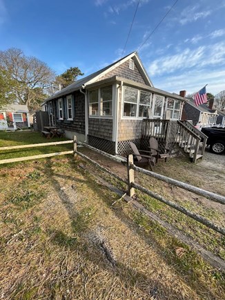 Dennis Port Cape Cod vacation rental - Outdoor shower, open lawn, picnic table, Adirondacks, gas firepit