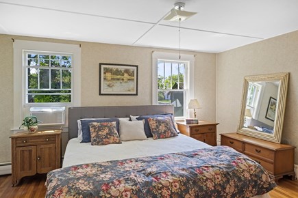 Orleans Cape Cod vacation rental - Primary bedroom with a king bed and ample storage space.