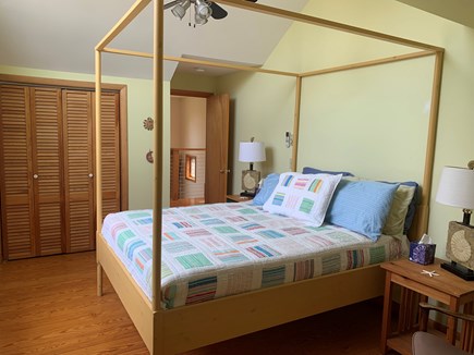 Orleans Cape Cod vacation rental - Master bedroom with four-poster bed, seating area & private bath.