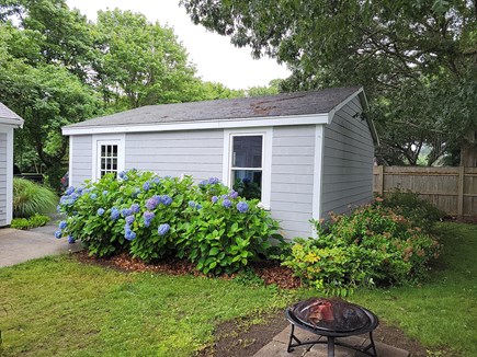 Falmouth Cape Cod vacation rental - Side of garage with fire pit