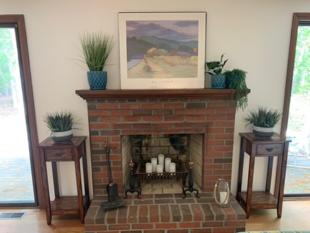 East Falmouth Cape Cod vacation rental - Sliders on either side of the fireplace to the back deck