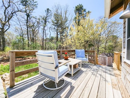 Harwich Cape Cod vacation rental - Additional outdoor seating near primary entrance of home.