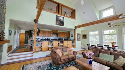 Truro Cape Cod vacation rental - Living room with dining area and open kitchen beyond