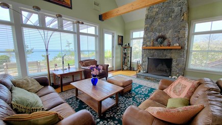 Truro Cape Cod vacation rental - Living room with comfortable seating and door to the deck