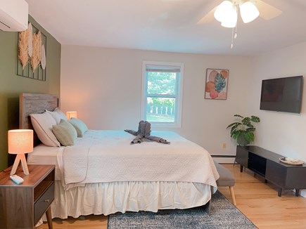 Mashpee Cape Cod vacation rental - Bedroom: Green room with TV. Queen bed