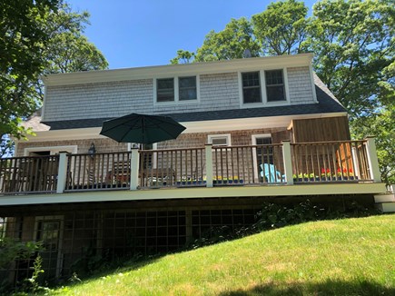 Mashpee Neck Cape Cod vacation rental - Large deck with dining, charcoal BBQ, outdoor shower.
