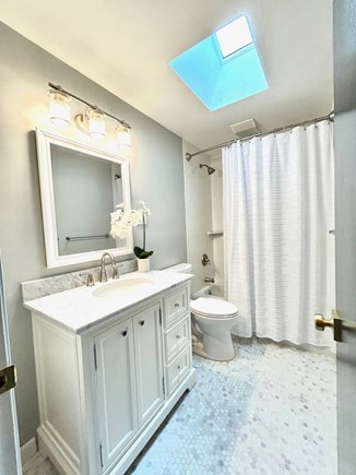 Eastham Cape Cod vacation rental - Newly renovated main bath with shower/tub combo and marble floor.