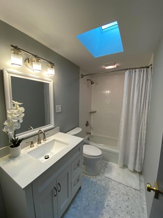 Eastham Cape Cod vacation rental - View of main bathroom with tub and shower.