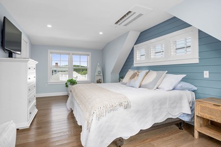 Chatham Cape Cod vacation rental - Primary bedroom encompassing the entire upper level of this home with ensuite bathroom, walk in closet and private deck