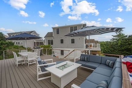 Chatham Cape Cod vacation rental - Lounge area of the main deck with comfortable sectional couch and fire table