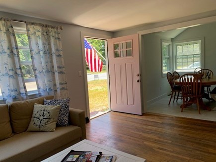 West Dennis Cape Cod vacation rental - The living room flows into the dining and kitchen areas.