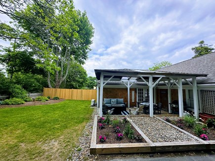 Dennis Cape Cod vacation rental - Outdoor seating & dining area with gas grill & propane firepit