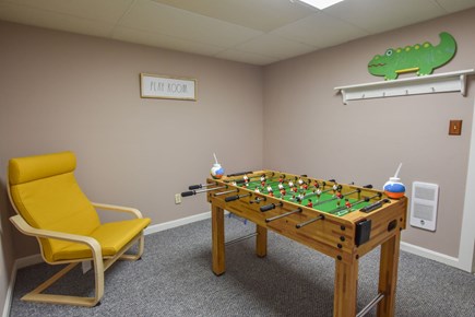 Brewster Cape Cod vacation rental - A game room in the finished basement has a foosball set.