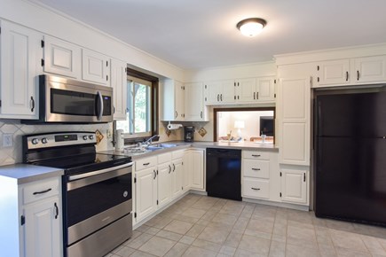 Brewster Cape Cod vacation rental - Kitchen with pass through window overlooking the the living area.