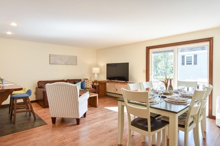 Brewster Cape Cod vacation rental - Living and dining area has access way to the wraparound deck.