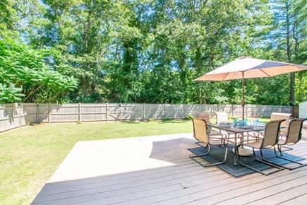 Sandwich Cape Cod vacation rental - Spacious backyard with deck and seating