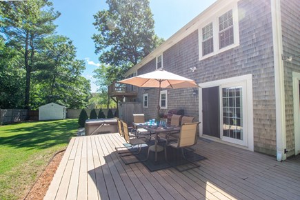 Sandwich Cape Cod vacation rental - Backyard with seating and hot tub!