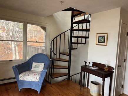 Brewster Cape Cod vacation rental - Spiral staircase down to the middle floor w/ two queen bedrooms.