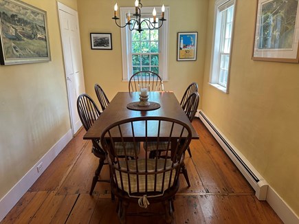 Wellfleet Cape Cod vacation rental - Dining room opens to living room, kitchen and stairs up.