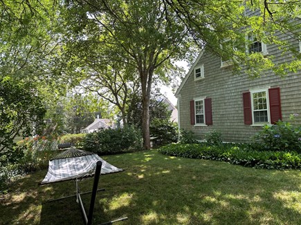 Wellfleet Cape Cod vacation rental - Shady side yard with hammock.