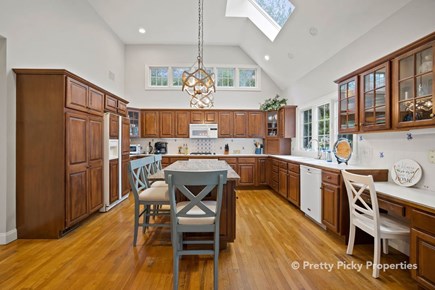 Brewster Cape Cod vacation rental - Beautiful kitchen with center island and counter seating. Note skylight and windows for a bright, cheery impression.