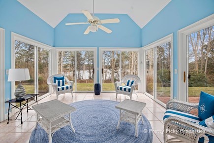 Brewster Cape Cod vacation rental - Three-season room is a screened porch in summer with a captivating water view.
