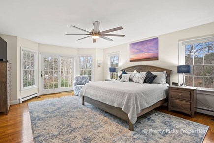 Brewster Cape Cod vacation rental - King master bedroom with a water view.