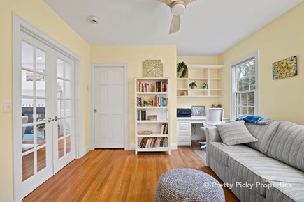 Brewster Cape Cod vacation rental - Another view of this main floor space which doubles as a work station and sleeping space.
The couch opens to be a queen size bed, providing flexible s
